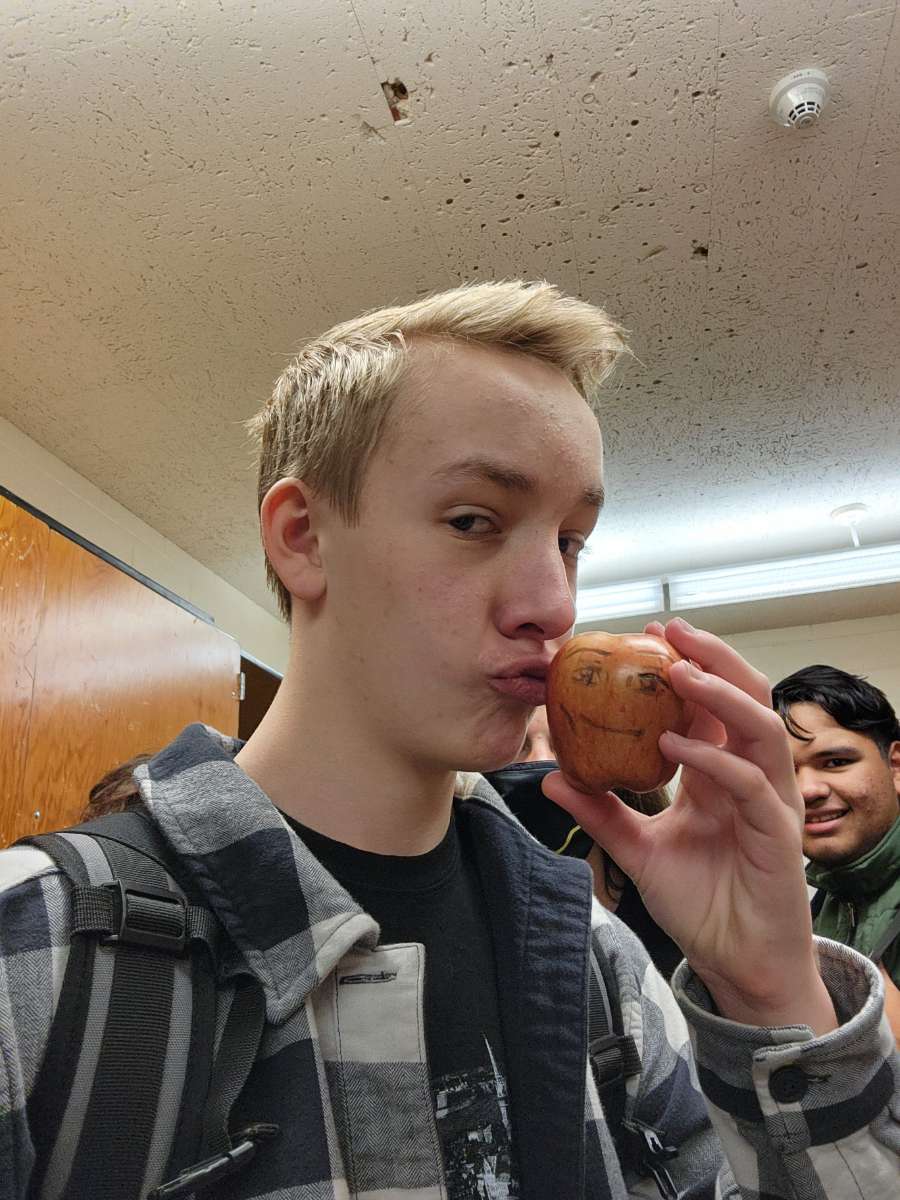 Gavin kissing an apple